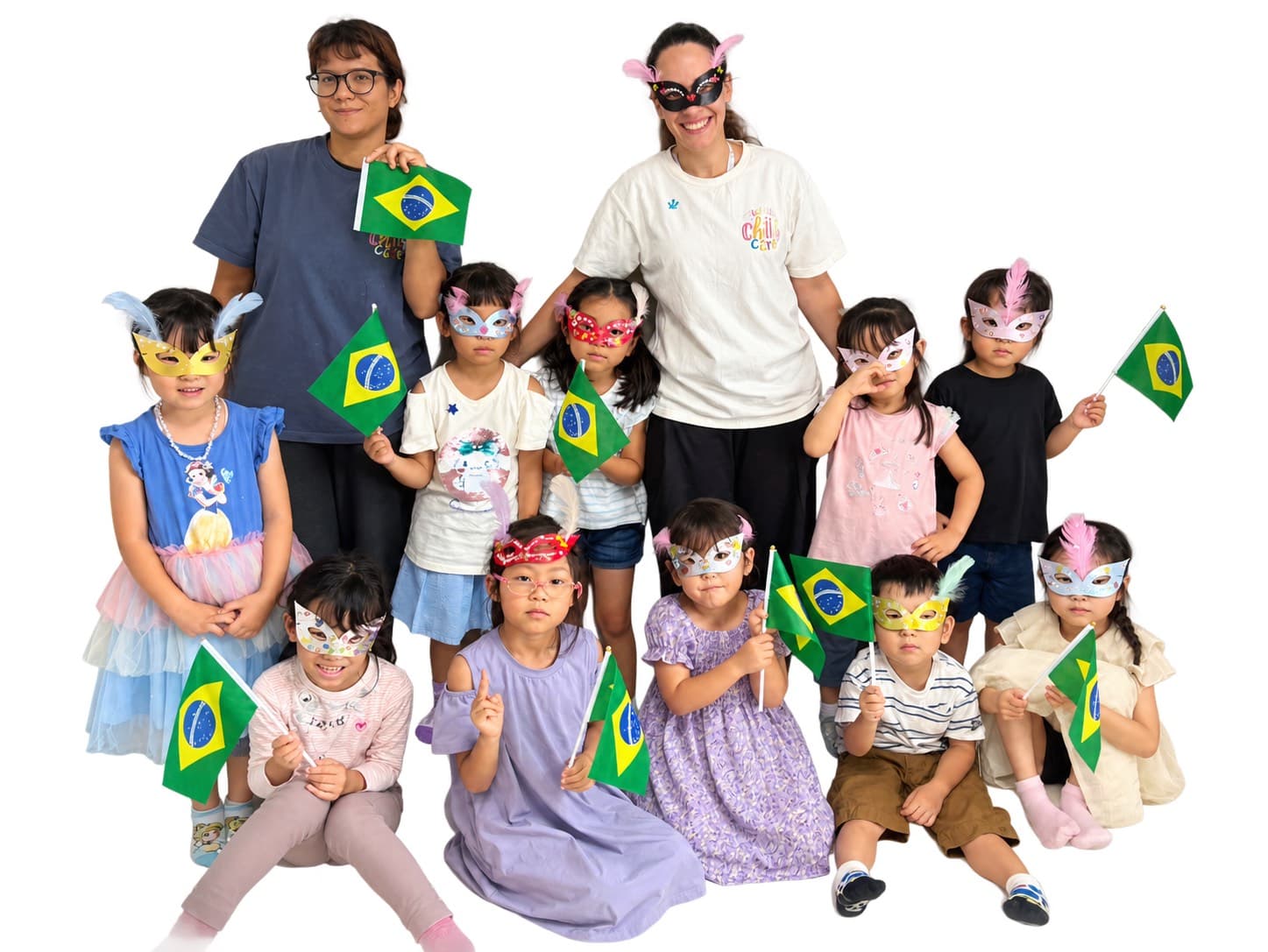 Marble childcare staff and children celebrating with festival masks and Brazil flags